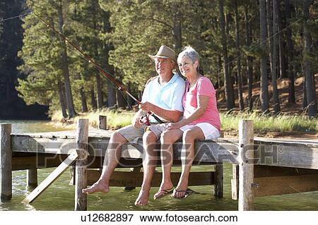 Stock Photo - Senior couple fishing. Fotosearch