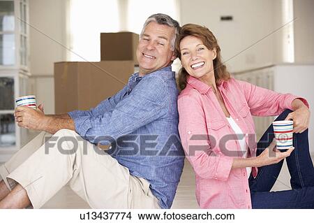 Picture - Senior couple in new home. Fotosearch