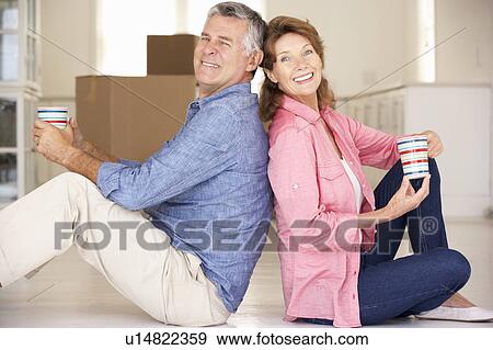 Stock Photo - Senior couple in new home. Fotosearch