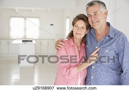 Stock Photo - Senior couple in new home. Fotosearch