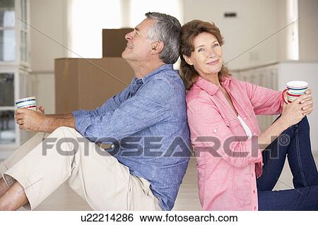 Stock Photograph - Senior couple in new home. Fotosearch