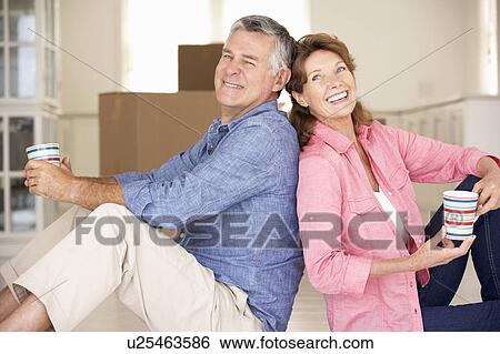 Stock Photograph - Senior couple in new home. Fotosearch
