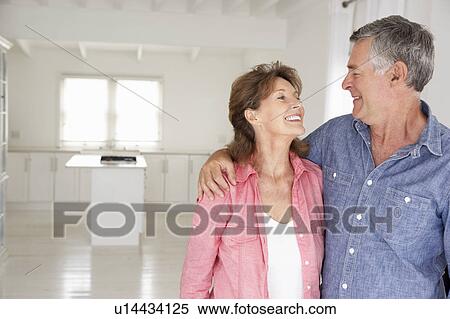 Stock Photography - Senior couple in new home. Fotosearch
