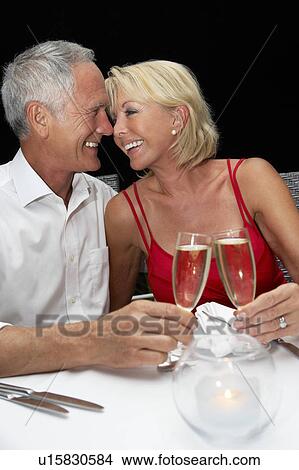 Picture - Senior couple in restaurant. Fotosearch
