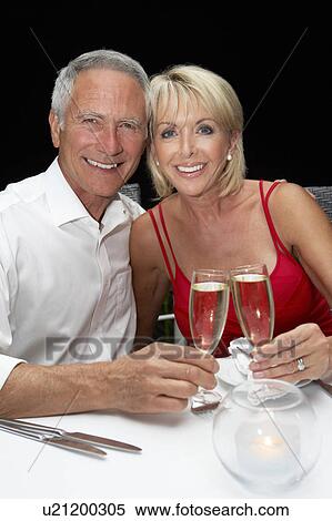 Stock Photography - Senior couple in restaurant. Fotosearch