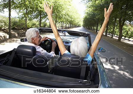 Picture - Senior couple in sports car. Fotosearch