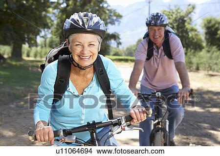 Senior couple on country bike ride View Large Photo Image Picture - Senior couple on country bike ride. Fotosearch