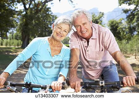 Senior couple on country bike ride View Large Photo Image Stock Photo - Senior couple on country bike ride. Fotosearch