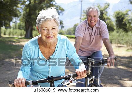 Senior couple on country bike ride View Large Photo Image Stock Photo - Senior couple on country bike ride. Fotosearch