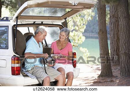 Stock Photo - Senior couple on country picnic. Fotosearch