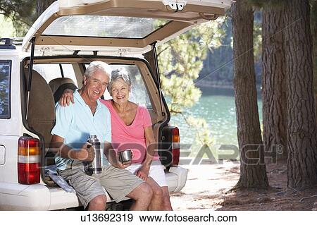 Stock Photo - Senior couple on country picnic. Fotosearch