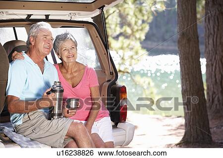 Stock Photograph - Senior couple on country picnic. Fotosearch