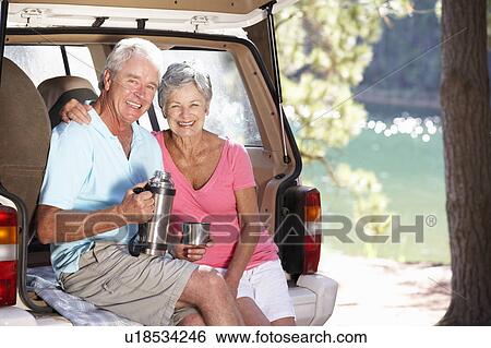 Stock Photograph - Senior couple on country picnic. Fotosearch