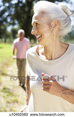 Senior couple on country run View Large Photo Image Stock Image - Senior couple on country run. Fotosearch