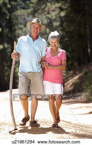 Picture - Senior couple on country walk. Fotosearch