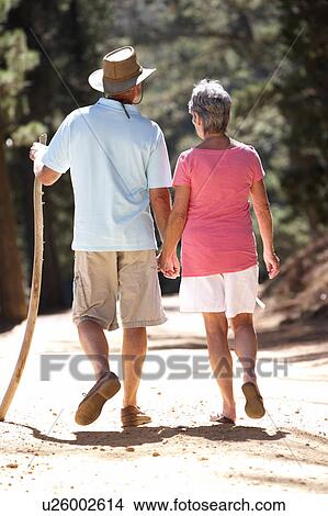 Picture - Senior couple on country walk. Fotosearch