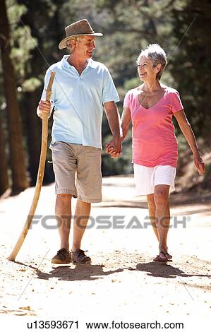 Senior couple on country walk View Large Photo Image Stock Image - Senior couple on country walk. Fotosearch
