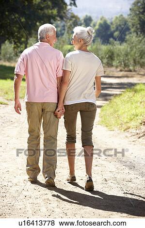 Stock Photo - Senior couple on country walk. Fotosearch