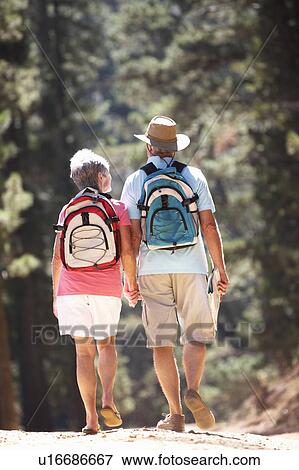 Stock Photo - Senior couple on country walk. Fotosearch