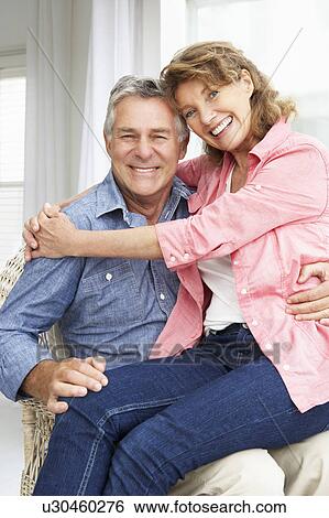 Stock Photograph - Senior couple relaxing at home. Fotosearch