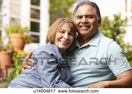 Stock Photo - Senior couple relaxing in garden. Fotosearch