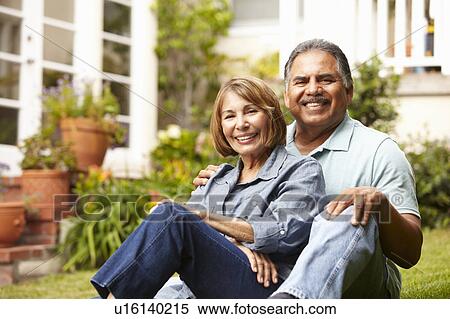 Stock Photography - Senior couple relaxing in garden. Fotosearch