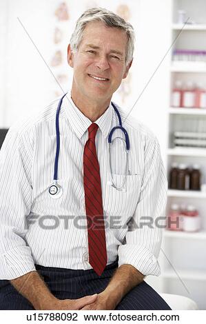 Senior doctor in consulting room View Large Photo Image Stock Image - Senior doctor in consulting room. Fotosearch