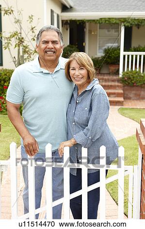 Senior Hispanic couple outside home View Large Photo Image Stock Image - Senior Hispanic couple outside home. Fotosearch