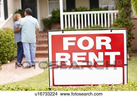Picture - Senior Hispanic couple renting new home. Fotosearch