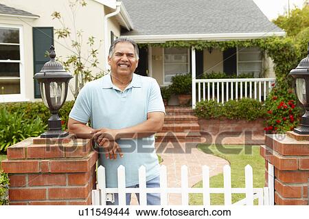 Senior Hispanic man outside home View Large Photo Image Picture - Senior Hispanic man outside home. Fotosearch