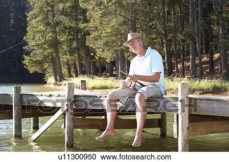 Senior man fishing View Large Photo Image Stock Image - Senior man fishing. Fotosearch