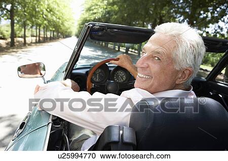Senior man in sports car View Large Photo Image Stock Image - Senior man in sports car. Fotosearch