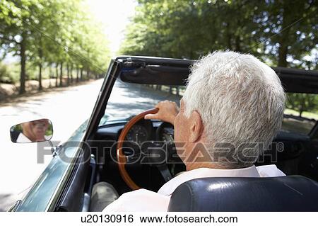 Senior man in sports car View Large Photo Image Stock Photograph - Senior man in sports car. Fotosearch