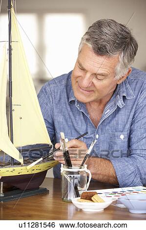 Stock Photograph - Senior man model making. Fotosearch