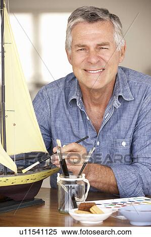 Stock Photography - Senior man model making. Fotosearch