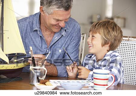 Senior man model making with grandson View Large Photo Image Picture - Senior man model making with grandson. Fotosearch