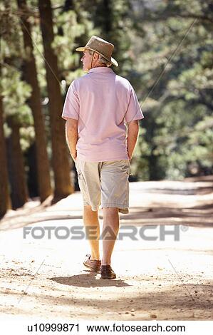 Senior man on country walk View Large Photo Image Stock Image - Senior man on country walk. Fotosearch