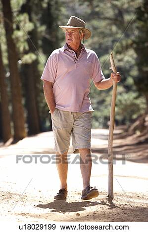 Stock Photo - Senior man on country walk. Fotosearch