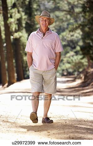 Senior man on country walk View Large Photo Image Stock Photo - Senior man on country walk. Fotosearch