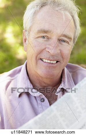 Senior man reading newspaper View Large Photo Image Stock Image - Senior man reading newspaper. Fotosearch