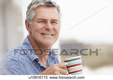 Senior man relaxing outdoors View Large Photo Image Stock Image - Senior man relaxing outdoors. Fotosearch