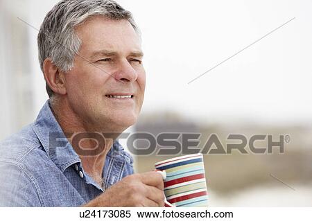 Stock Photography - Senior man relaxing outdoors. Fotosearch