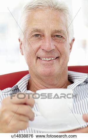 Senior man relaxing with cup of tea View Large Photo Image Stock Photograph - Senior man relaxing with cup of tea. Fotosearch