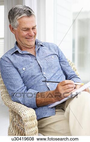 Senior man sketching View Large Photo Image Stock Photo - Senior man sketching. Fotosearch