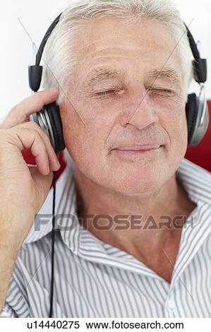 Senior man with headphones View Large Photo Image Stock Photography - Senior man with headphones. Fotosearch