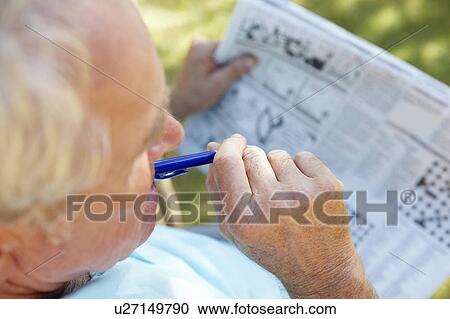Stock Image - Senior man with newspaper. Fotosearch