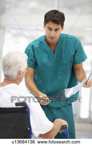 Stock Photo - Senior patient with young doctor. Fotosearch