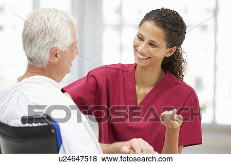 Stock Photo - Senior patient with young doctor. Fotosearch