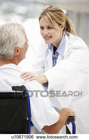 Senior patient with young doctor View Large Photo Image Stock Photograph - Senior patient with young doctor. Fotosearch