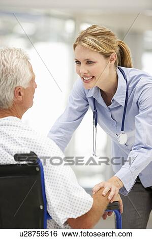 Stock Photograph - Senior patient with young doctor. Fotosearch